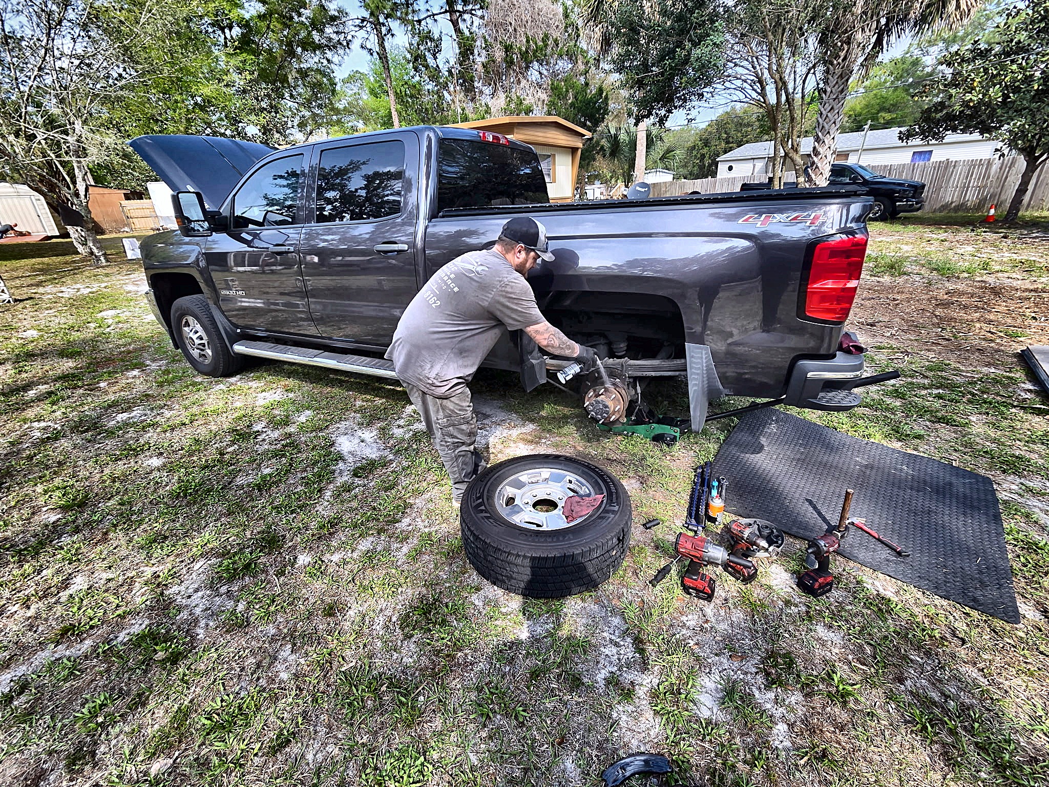 Tire work beside a customer's pickup